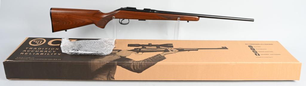 BOXED CZ 452 2E BOLT ACTION 22 LR RIFLE LEFT HAND: SERIAL b447585 BARREL: 22" CALIBER .22 LR. Features blued finish, checkered stock and fore-end., and comes in original factory cardboard box. Weaver rail at receiver, no sights. Appears as new in the 