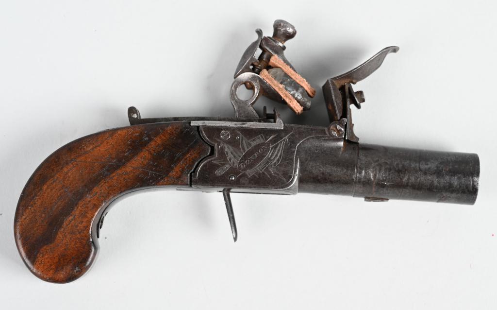 NOCK & CO. LONDON FLINTLOCK BOOT PISTOL: BARREL 2". CALIBER 50 BORE. Nice little early 19th century flintlock boot single shot pistol. Frame is stamped Nock & London on both sides. Grips are one piece walnut. Metal is rich patina with razor 