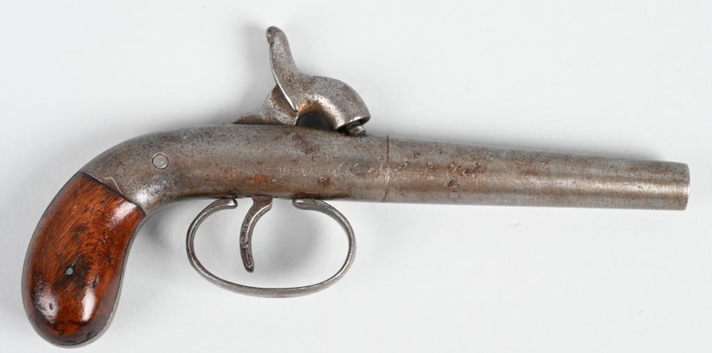 MID 19TH CENTURY BOOT PISTOL: Early hide out pistol , percussion, single shot, .28 caliber with walnut bag style handle. Metal is a soft patina with average freckling. Works perfectly. A
