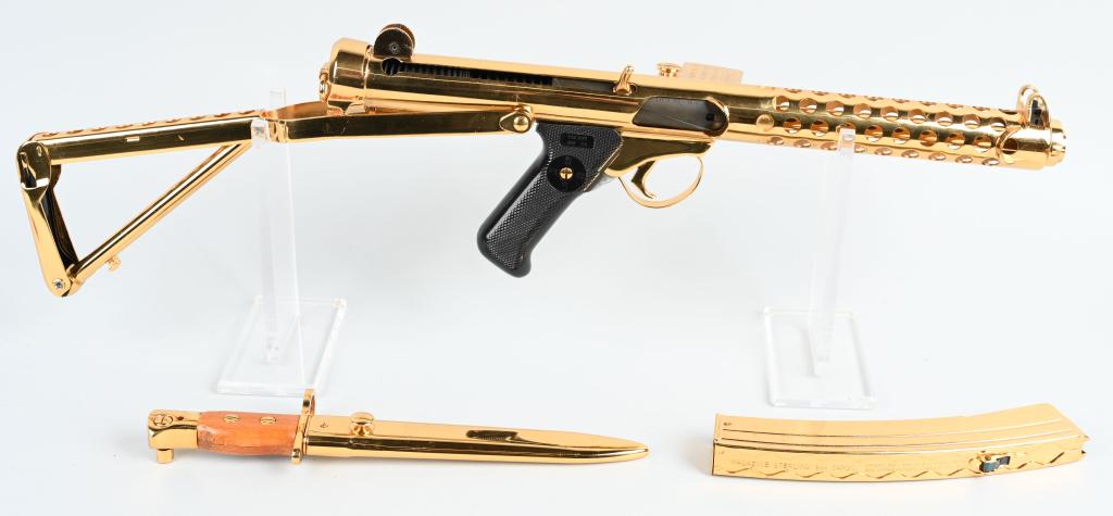 GOLD PLATED STERLING MODEL MK6 SEMI-AUTO: Serial #SA0183. Barrel length 9". Caliber 9mm. GOLD PLATED STERLING MK6 9mm ONE OF A KIND DISPLAY. SN SA0183. 8" barrel (smooth bore). Sterling Semi Automatic 9mm Carbine MK6 stamped on the receiver. 
