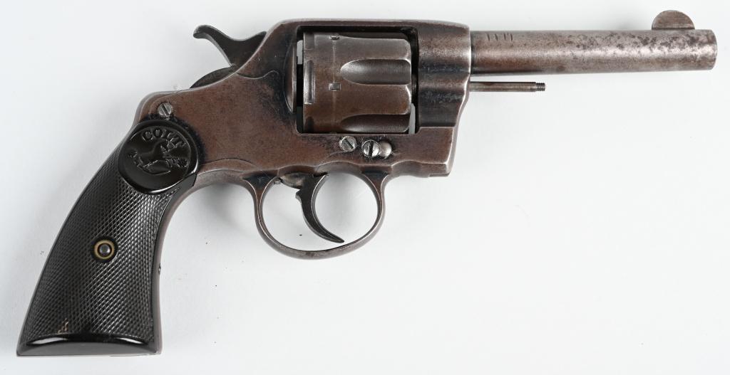 COLT ARMY-NAVY DOUBLE ACTION REVOLVER: SERIAL 231760. BARREL 4". CALIBER .38 LONG COLT. MADE IN 1904. Features six shot, double action blue finish, Colt Pony gutta percha grips. This was Colts first ever revolver with the swing out cylinde