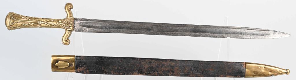 19th CENT. BRASS HILT SHORT SWORD W/ SCABBARD: The sword has an ornate cast brass hilt. The unmarked blade is 16 1/2" long and has an unstopped fuller on both sides. The blade has evidence of old sharpening and is missing the leather washer. Inclu