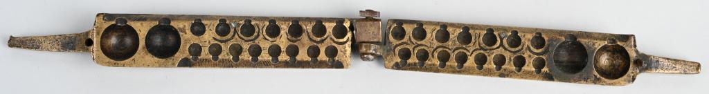 18th CENT. REVOLUTIONARY WAR GANG BULLET MOLD: Original 18th century brass gang bullet mold that makes 17 bullets. The largest caliber is about .62. It is marked with initial "R.M." on one side. The handles have been shortened, and there is a very