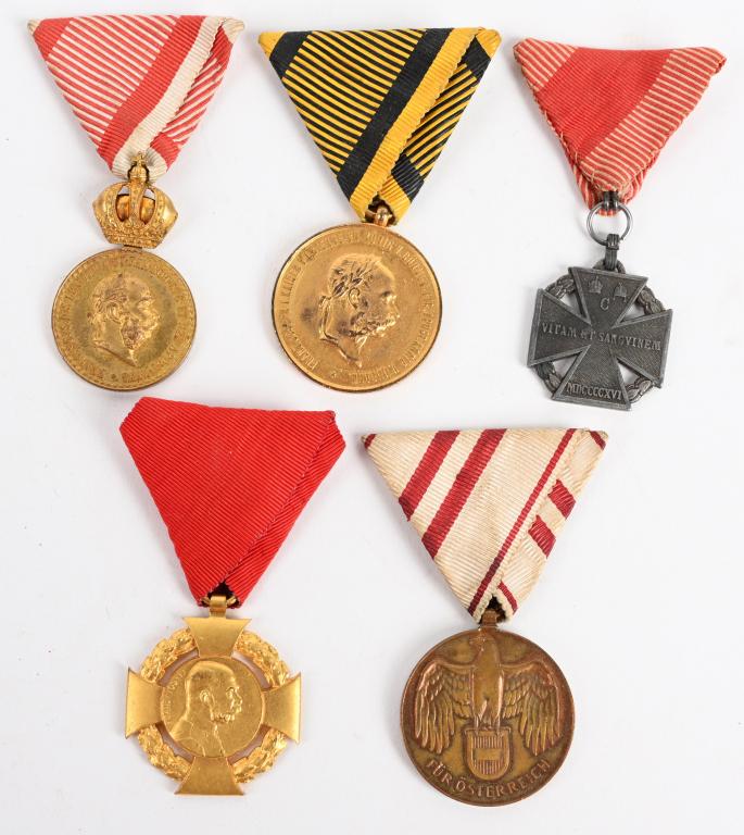 WW1 AUSTRIAN MEDAL LOT OF 5 AUSTRO-HUNGARIAN: Lot of 5 Austrian medal lot including Austrian First World War Commemorative Medal, Karl Troop Cross 1916, Military Merit Medal, Austria Hungary medal 1873 campaigns and finally 60th Anniversary of th