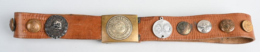 WW1 IMPERIAL GERMAN PRUSSIAN HATE BELT & BUCKLE: WW1 Imperial German enlisted belt with 21 devices attached to leather belt commonly called a "Hate Belt". The M1895 pattern belt and buckle is a standard NCO set that is a two-piece brass construction