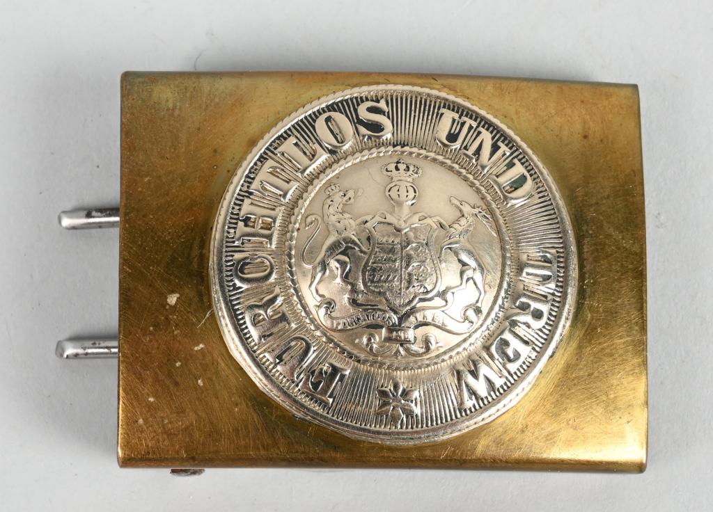 WW1 IMPERIAL GERMAN WURTTEMBERG BELT BUCKLE WWI: 1895 pattern two-piece brass and nickel/silver construction Wurttemberg belt buckle. The 48mm, slightly convex, stamped metal box buckle features against its plain obverse field a crown to its domed c