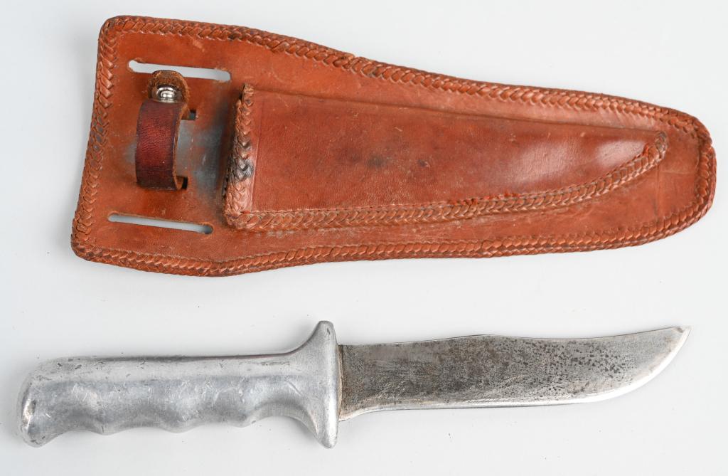 WWII US THEATER MADE ALUMINUM TRENCH KNIFE: Theater-made trench combat knife with cast aluminum handle, ergonomically designed with finger grooves and a low profile guard. 9.5" overall, 5.2" blade with a 2.5" clip point. No markings, light hand