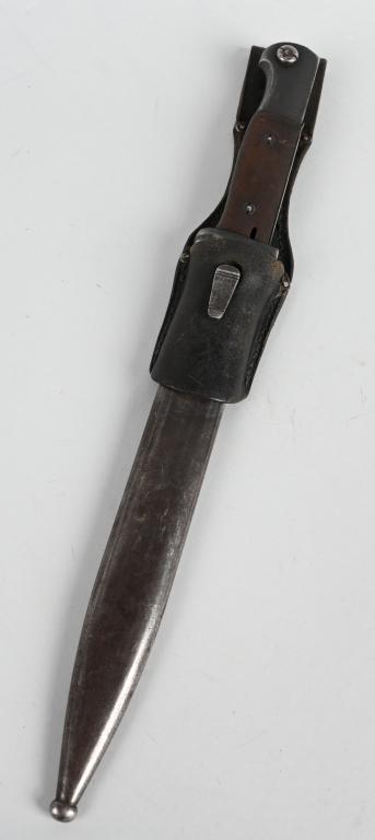 WWII NAZI GERMAN K98 MATCHING BAYONET WKC 37: Roughly 25cm long drop forged steel construction blade with wide fullers. Blade retains most of it's original blueing. Wood grip. Stud functions well. Both sides of the ricasso are well marked with im