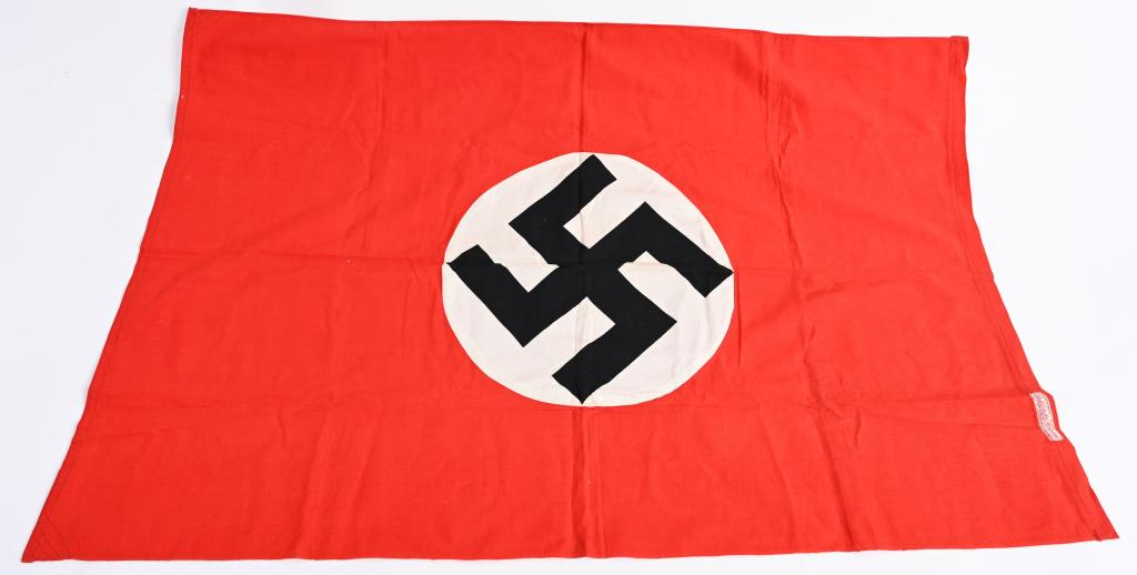 WWII NAZI NSDAP GERMAN NATIONAL FLAG WW2: Roughly 25x38 inch double sided, three piece, printed, cotton and rayon construction national flag features a red cotton base field with a central white circular disc with a canted black printed swast