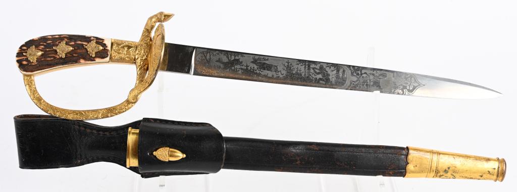 WWII NAZI GERMAN FORESTRY CUTLASS BY EICKHORN: This example is constructed of fine quality brass mounts. The "D" guard is adorned with banner's and oak leaves and at the end there is a simulated deer hoof. The hair of the hoof is hand-chiseled at 