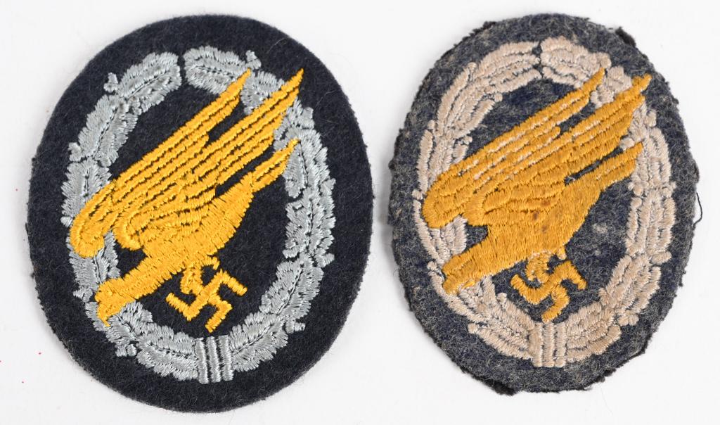 WWII NAZI GERMAN LUFTWAFFE PARATROOPER BADGE LOT 2: Lot of two Luftwaffe paratrooper badges consists of a roughly, 70mm tall, 60mm wide, Luftwaffe blue/gray wool construction, vertically oval, base which features a machine embroidered, stylized "diving