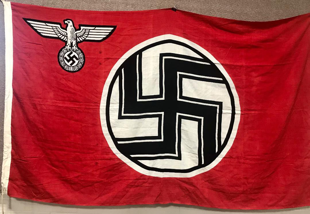 WWII NAZI GERMAN STATE SERVICE FLAG 1.5 X 2.5: A 1935 pattern double sided printed cotton/linen construction flag. The flag features a red base field white with a white central circular field with a black and white bordered black static swastika t