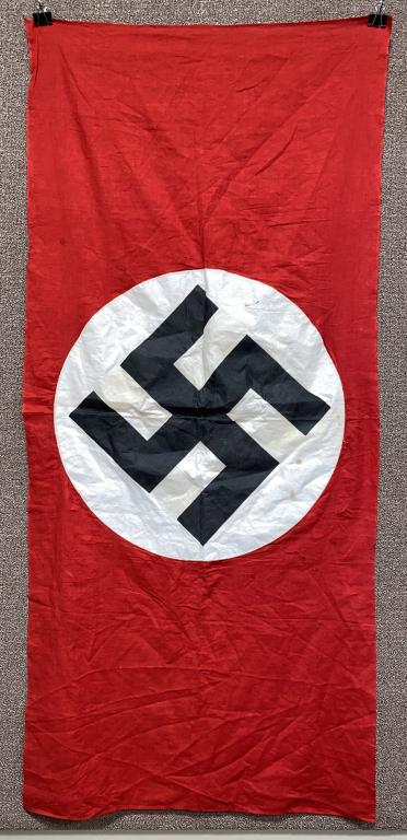 WWII NAZI GERMAN NSDAP WALL BANNER FLAG: Multi-piece cotton construction banner approximately 57 x 26 inches. To both its red fields are sewn have white disks with a printed mobile swastikas in black. Shows the expected period use and wear b