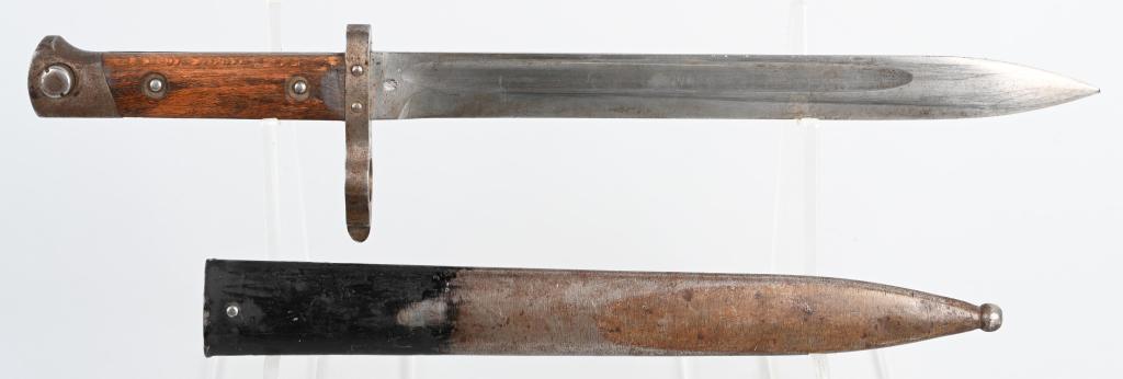 AUSTRO-HUNGARIAN M1895 CARBINE BAYONET: Austro - Hungarian Model 1895 carbine bayonet with muzzle ring front sight, wood grips, Austrian proofs, and steel scabbard. Reverse-mounted blade (cutting edge faces muzzle). 9.8" blade, 14.1" overal