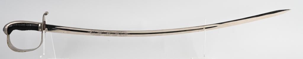 IMPERIAL GERMAN BAVARIAN ARTILLERY OFFICER SWORD: Sword features a 30 inch long curved and fullered nickel-plated steel blade magnetic with a blade spine and a single dull edge the blade remaining bright and crisp and having an extremely sharp tip. T