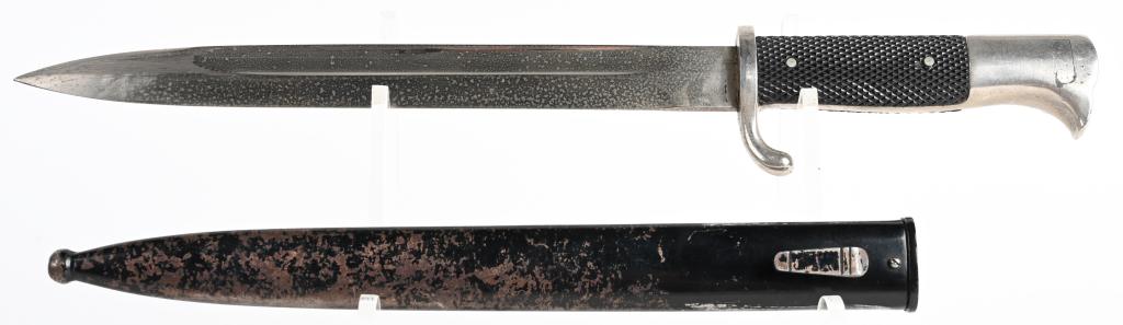 WWII NAZI GERMAN WKC k98 DRESS BAYONET & SCABBARD: Marked "WKC" with a knight logo at the ricasso. 9.8" blade with a 1.8" false edge, 14.6" overall length. Has black composite grips and black painted steel scabbard. Scabbard shows age and wear, retain