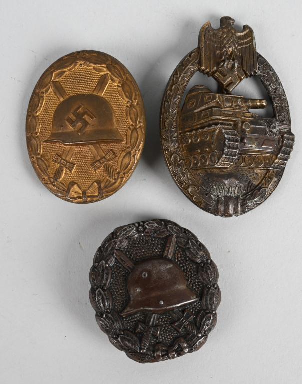 WWII NAZI GERMAN COMBAT MEDAL LOT PANZER BADGE ECT: Lot of three WW1 and WWII Nazi German medal of including a black Imperial wound badge that is die struck hollow backed magnetic sheet metal construction badge. Finish is worn. The badge is in the form