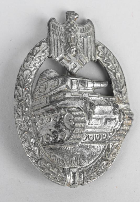 WWII NAZI GERMAN PANZER ASSAULT BADGE IN SILVER: Die struck alloy construction, partially scooped backed, badge with a silver washed finish features a vertically oval oak-leaf wreath with a Wehrmacht style eagle with down-swept wings, superimpose to