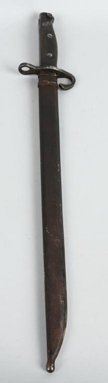 WWII JAPANESE ARISAKA BAYONET & SCABBARD: 18" overall, with scabbard and quillion. Toyo Kogyo arsenal mark at ricasso. Blade has been sharpened and ground. Shows wear and age. Good