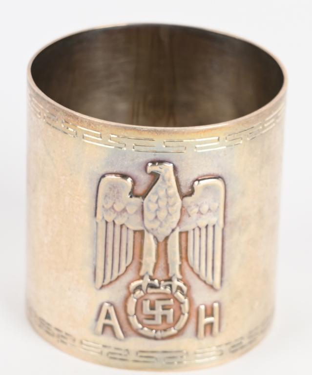 WWII NAZI ADOLF HITLER FORMAL SERVICE NAPKIN RING: ADOLF HITLER FORMAL SERVICE NAPKIN RING Fine original formal silver napkin ring from one of Hitler's formal dinner services, 1 3/4" tall, 1 1/2" diameter, bearing a large Nazi eagle and swastika devic