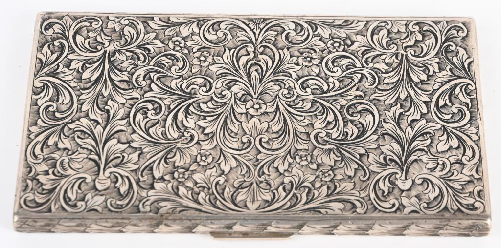 WWII NAZI GERMAN EVA BRAUN SILVER CIGARETTE CASE: Eva Braun Cigarette Case from Personal Silver Service. Intricate, hand-tooled cigarette case with push button cover latch and spring activated cigarette retainer. Inside lid stamped “800” with man