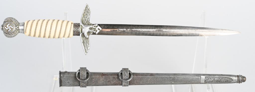 WWII NAZI GERMAN LUFTWAFFE OFFICER DAGGER: Roughly 29cm long bright nickel/silver plated double edged drop forged steel stiletto style blade with a flat central plane. The leather washer is still intact. The dagger has a well defined, nicely d