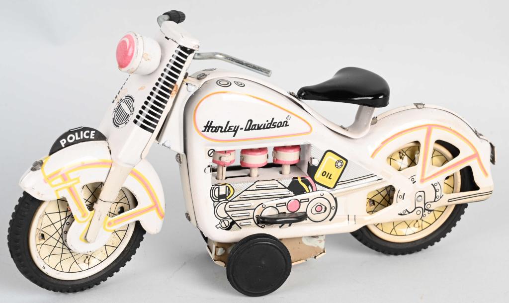 TIN FRICTION POLICE HARLEY DAVIDSON MOTORCYCLE: Unusual version all white Police Harley Davidson. Friction works. Made in Japan. 9" Excellent