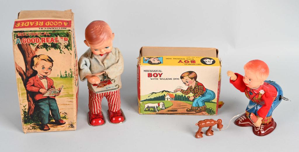 2- JAPAN WINDUP BOY TOYS w/ BOX: Includes A Good Reader all original and working. Plus Boy with Walking Dog all original and working. Both Boxed. Largest 7" Excellent