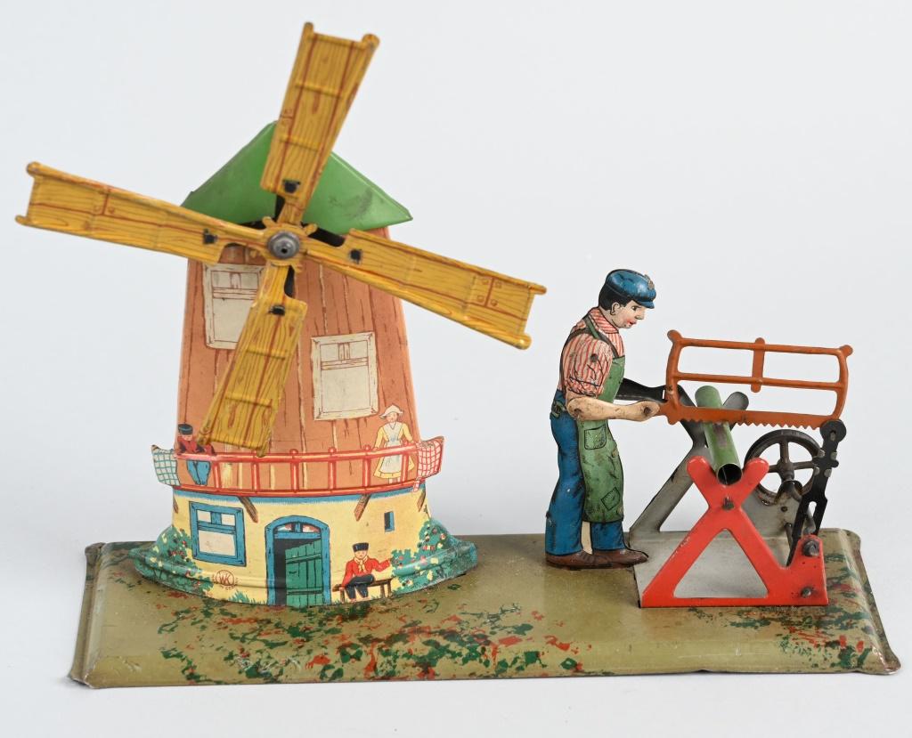GERMAN STEAM TOY ACCESSORY WIND MILL & MAN SAWING: Original steam toy accessory. Windmill and Man Sawing. All original. 9 1/2" Excellent