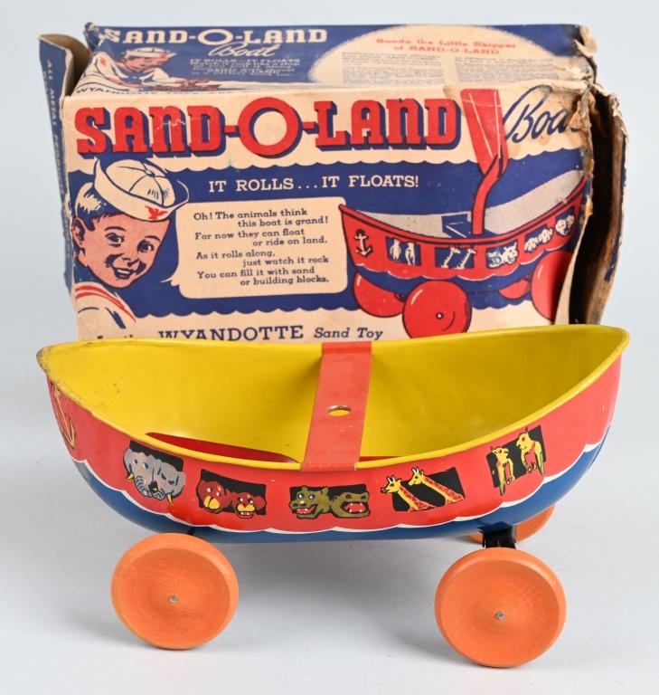 WYANDOTTE SAND O LAND BOAT w/ BOX: Great looking Boat shaped Sand Toy. Complete with shovel. Nice graphics. Boxed 10" Excellent