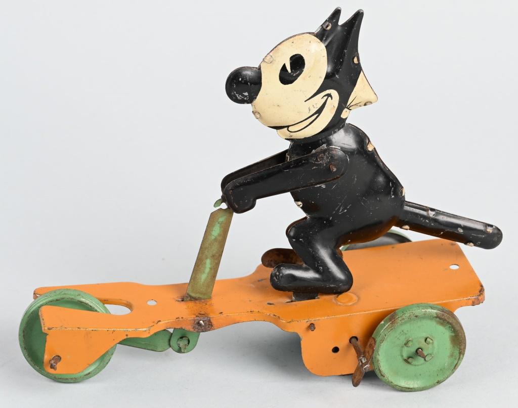 NIFTY TIN WINDUP FELIX THE CAT ON SCOOTER: All original early Felix tin windup toy. Windup works. 8" Very Good