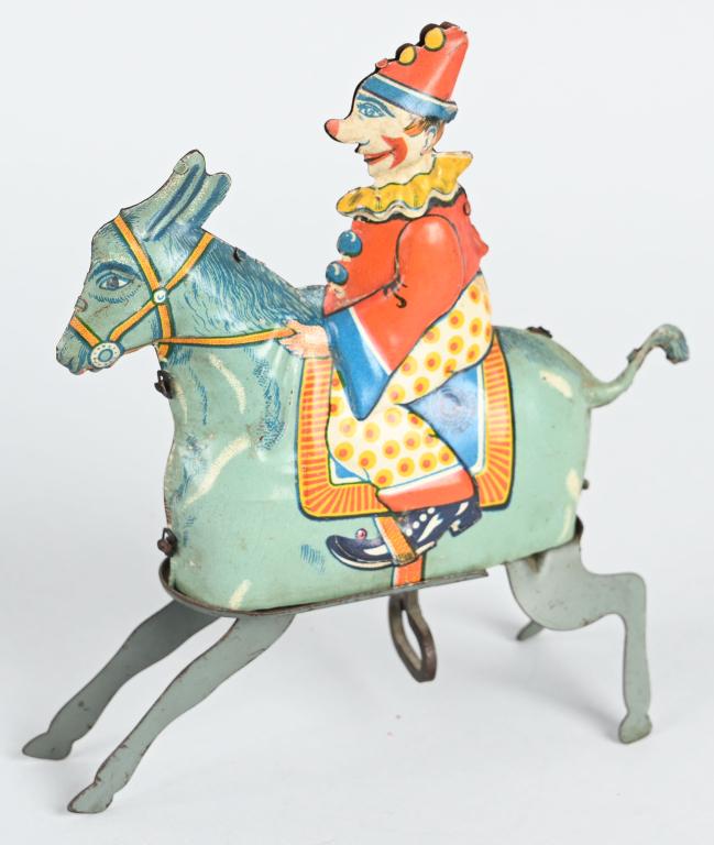GUNTHERMANN TIN WINDUP CLOWN ON DONKEY: All original with nice colors. Works. 5 1/2" Excellent