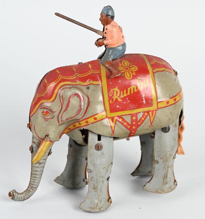 GERMAN TIN WINDUP RUMBA ELEPHANT: All original with rider on back. Windup neeeds repair. 5" Very Good