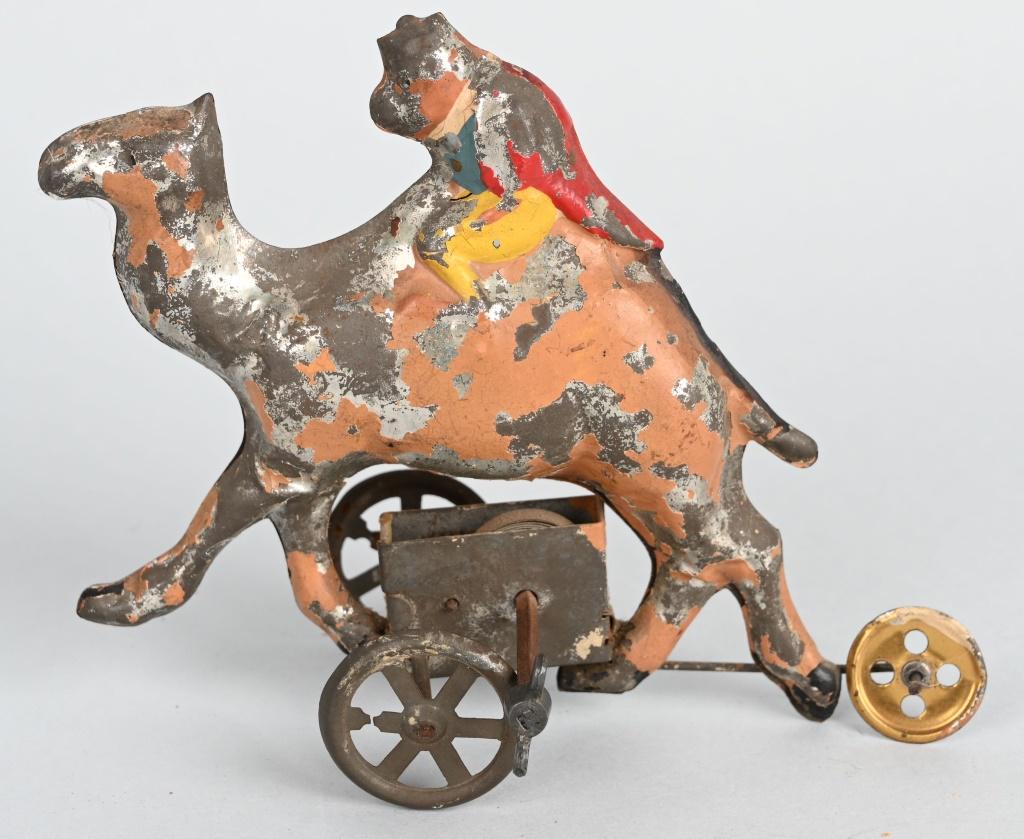 GERMAN TIN WINDUP HAND PAINTED MONKEY ON CAMEL: All original. Unusual subject matter. Windup works. 6" Very Good