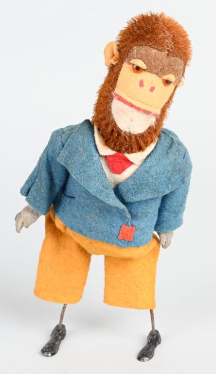 GERMAN WINDUP MOHAIR MONKEY w/ LEAD FEET: All original felt dressed mohair over sized head monkey with lead feet. Windup needs repair. 8 1/2" Excellent