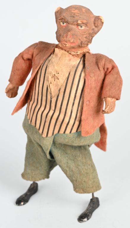 GERMAN WINDUP COMPOSITION MONKEY w/ LEAD FEET: All original felt dressed composition monkey with lead feet. Windup works. 8 1/2" Excellent