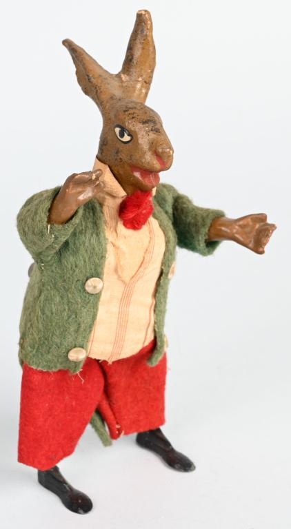 GERMAN WINDUP COMPOSITION EASTER RABBIT: All original felt dressed composition Easter Rabbit with lead feet. Windup works. One ear repaired. 8 1/2" Excellent