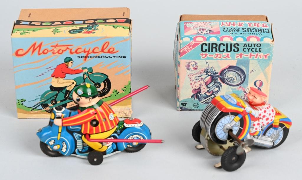 2- TIN WINDUP MOTORCYCLE TOYS w/ BOXES: Includes Circus Motorcycle all original and working. Plus Somersaulting Motorcycle all original and working. Both boxed. Largest 4 1/2" Excellent