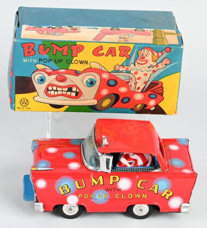 JAPAN TIN FRICTION CLOWN BUMP CAR w/ BOX: All original and looks never played with. Great colors. Cars bumps into something and the Clown pops out. Works. Boxed 7" Excellent