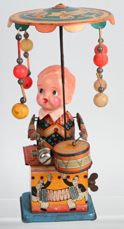 JAPAN WINDUP CELLULOID & TIN DRUMMER WHIRLY GIG: All original with great colors and action. Windup works. 10" Excellent