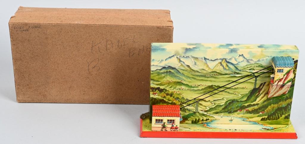 GERMAN TIN WINDUP SKY RIDE w/ BOX: All original with great colors and graphics. Works. Boxed 9 1/2" Excellent