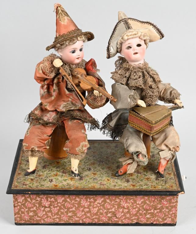 GUSTAVE VICKY HAND CRANK 2 DOLL MUSICIAN AUTOMATON: Wonderful attributed Gustave Vicky hand crank 2 bisque doll musician automaton. Both porcelain heads marked S&H and FB in a Star for Simon & Halbig. Figures have carved wood hands and legs. Both dress