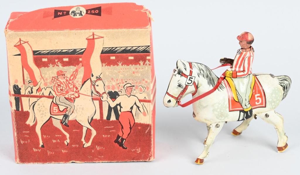 GERMAN TIN WINDUP JOCKEY ON HORSE w/ BOX: All original with nice details. Windup works. Boxed 6" Excellent