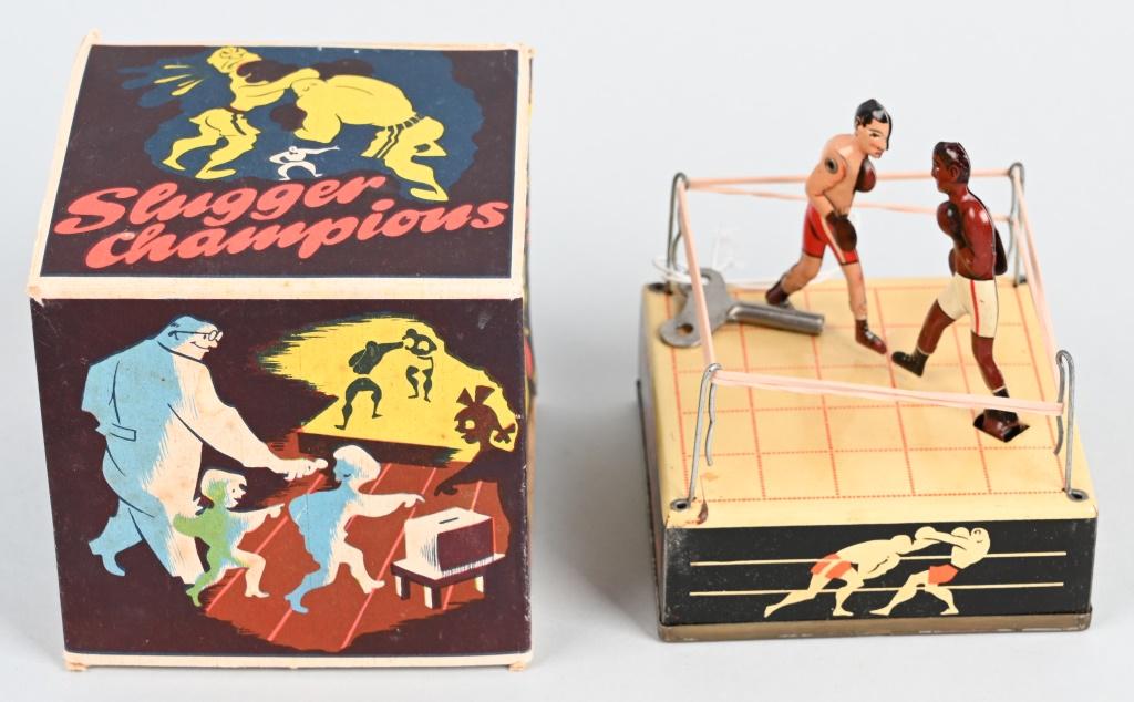 GERMAN TIN WINDUP SLUGGER CHAMPIONS w/ BOX: All original and looks never played with. Windup works. Boxed 3 3/4" Excellent