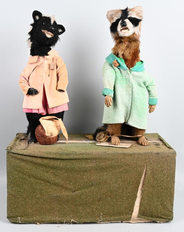 POLAR BEAR & SKUNK DEPARTMENT STORE AUTOMATON: Wonderful original Christmas window display electric automaton from Stewarts Departments Store in Baltimore, MD. Fancy dressed Polar Bear and Skunk stand on green base. Piece is electric powered and t