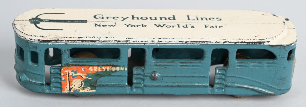 ARCADE cast iron N.Y. WORLD'S FAIR GREYHOUND BUS: Very nice all original 1930's toy with no cracks or breaks. Nice original paint and has nickel grill. 6 1/2", Excellent