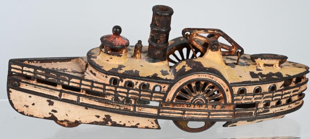 WILKINS "PURITAN" CAST IRON SIDE WHEELER BOAT: All original and complete. Has tiny chip on back of boat. Displays great. 10 1/2" Very Good