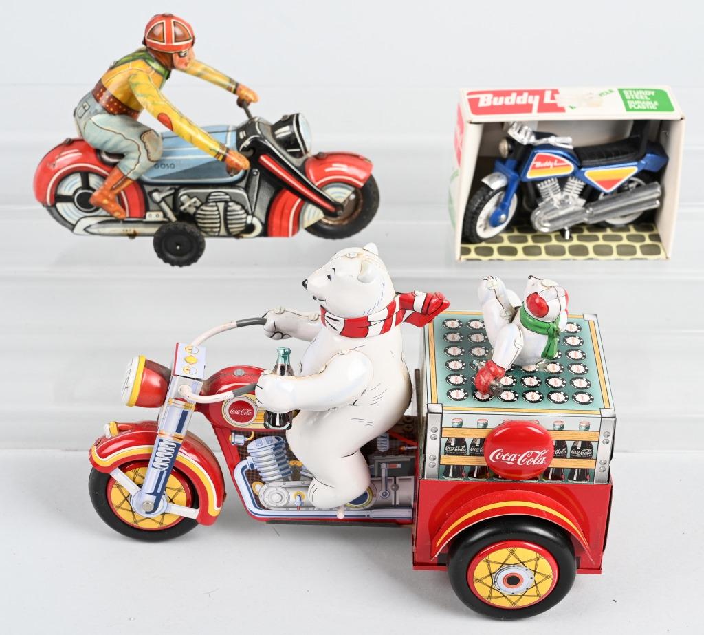3- MOTORCYCLE TOYS: Lot includes a nice working Franklin Mint tin windup Coca Cola Cycle, a 1978 Buddy L Motorcycle in the original box, along with a tin windup German motorcycle missing one leg. The windup toys both wor