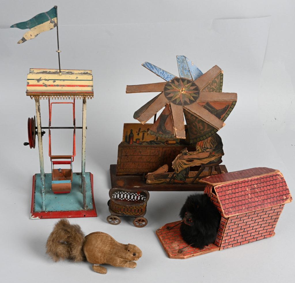 VINTAGE TOY LOT: Lot includes steam toy Ferris Wheel, German Dog Dog House, Early tin Buggy, Cardboard Mechanical Cobbler that needs repair, and Japan windup Squirrel. Largest 11". Good-Very Good