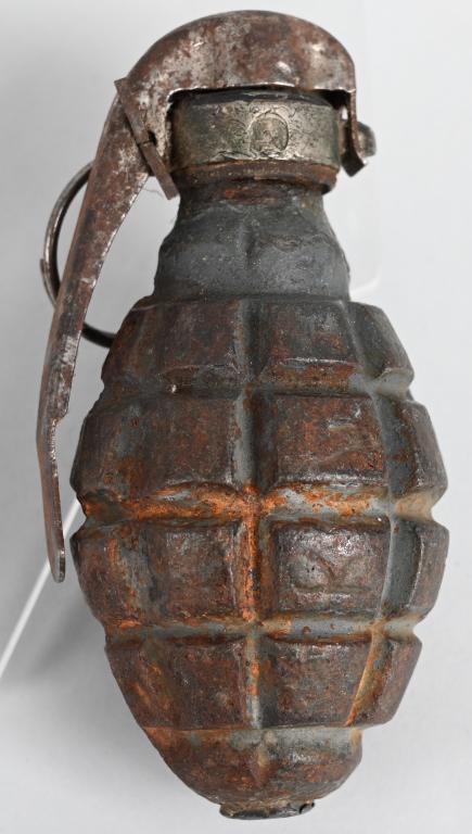 WW1 FRENCH TYPE F1 HAND GRENADE INERT W/ FUZE WWI: Highly Desirable WWI French Hand Grenade Type F1. Shows expected oxidation and wear overall, otherwise very good. This example has been deactivated. size 4 3/4" x 2". The F-1 grenade was first put int